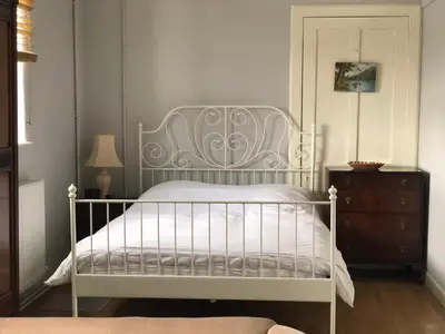 a bedroom with a white bed and a dresser at The Annex, countryside escape in Dumfries
