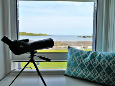 a camera on a tripod in front of a window at The View in Garlieston