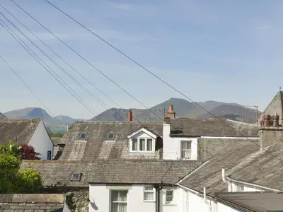a group of roofs with mountains in the background at Causey View in Keswick