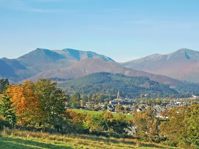 a town in a valley with mountains in the background at Causey View in Keswick