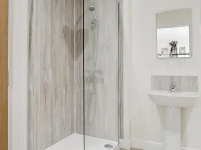 a bathroom with a shower and a sink at Lucy's At The Grange - Uk11519 in Mockerkin