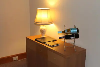 a lamp on top of a dresser with a camera at Number 48 in Dumfries