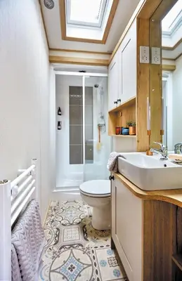 a bathroom with a sink and a toilet at Platinum Holiday Caravan in Bothel
