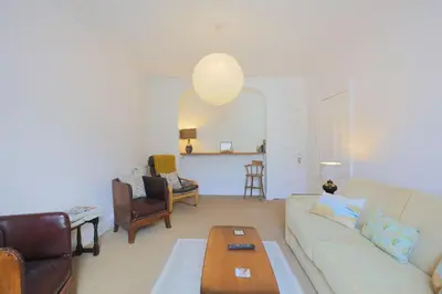 a living room with a couch and a table at 57 High Street in Kirkcudbright