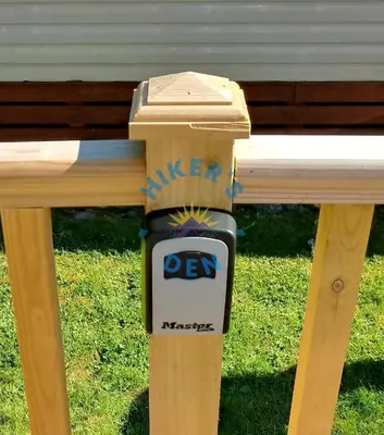 a wooden fence with a sign that says kitchen reps at Hikers Den, Brigham, Cockermouth, Cumbria in Cockermouth