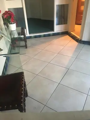 a tile floor in a room with a door and chairs at The Clan MacGregor Room in Kilmarnock
