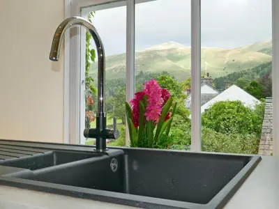 a kitchen sink with a view of a window at Easedale Corner in Grasmere