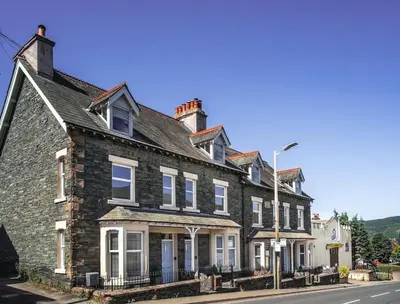 a large brick building on the side of a street at 5 The Townhouse in Keswick