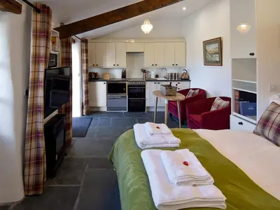 a room with a bed with two towels on it at Field House Bothy - Uk12571 in Borrowdale Valley