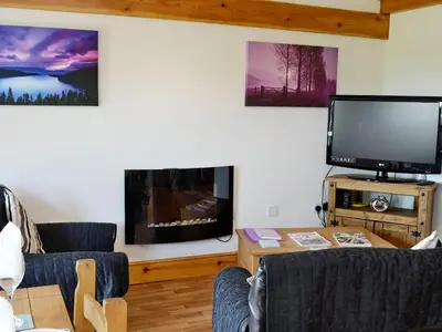 a living room with a large flat screen tv and a living room at Pheasant Cottage - Ukc3428 in Dalston