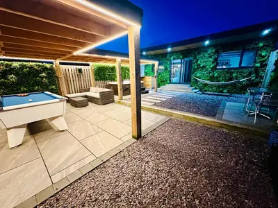 a backyard with a pool table and a house at Hazells Lodge Farm Stay Sleeps 2 Undercover Hottub and Pool Table in Galston
