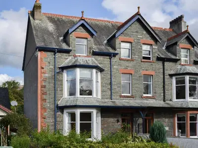 a large brick house with white windows at The Birches in Keswick