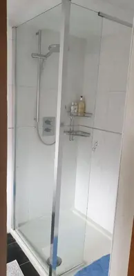 a shower with a glass door in a bathroom at Mona Villa Holiday Home in Coulderton