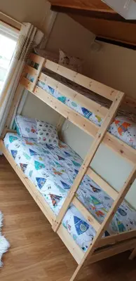 a bunk bed in a room with a bunk bedsheet at Mona Villa Holiday Home in Coulderton