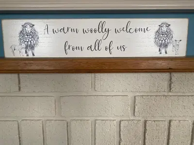 a sign on a wall that reads a usefulweekly welcome from all of us at Carrick Beg Self Catering Holiday Accommodation with Hot Tub in Sulby