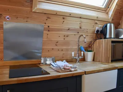a kitchen counter with a sink in a tiny house at Black Coombe-Uk1392 in Corney