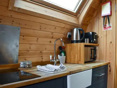 a kitchen with a sink and aaucet in a tiny house at Withy Bottom-Uk1393 in Corney
