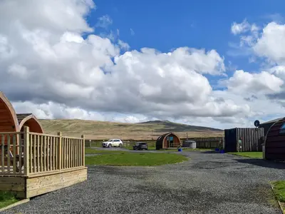 a parking lot with a fence and a barn at Stainton-Uk1395 in Corney
