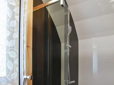 a shower with a glass door in a bathroom at Manx View-Uk1396 in Corney