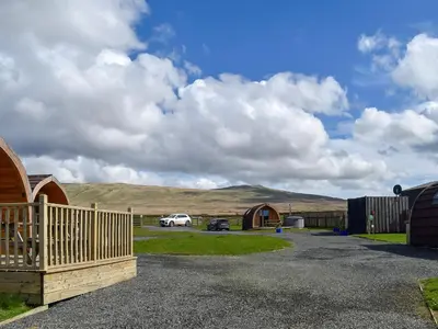a car parked in a parking lot next to some buildings at Selker View-Uk1397 in Corney