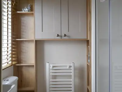 a bathroom with white cabinets and a toilet at Watches - Uk13544 in Bassenthwaite