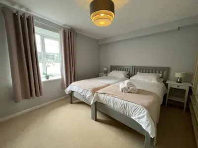 a bedroom with two beds with stuffed animals on them at Fellseeker in Keswick