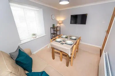 a living room with a table and a couch at Fellseeker in Keswick