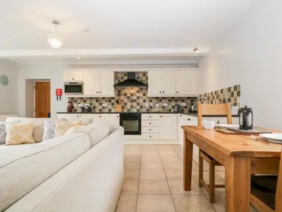 a living room with a white couch and a table at High Spy in Keswick