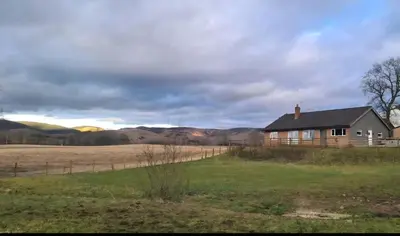 a house in the middle of a field at Cleughfoot House in Moffat