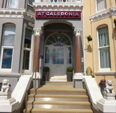 a building with stairs leading up to a door at At Caledonia in Douglas