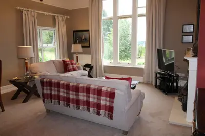 a living room with two couches and a tv at Geltsdale Garden Apartment ground floor home in Wetheral close to Carlisle & Ullswater in Wetheral
