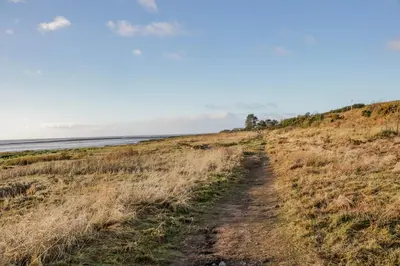 a dirt trail leading to the beach at 2 Whiterow in Powfoot