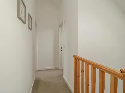 a room with a staircase and a stair case at Coney Garth Barn in Beckermet