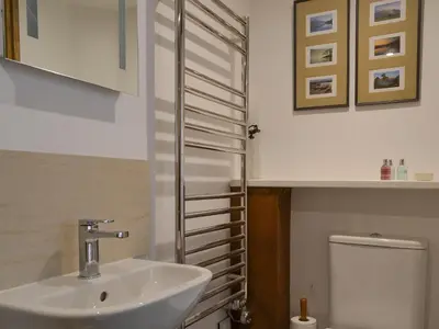 a bathroom with a sink and a toilet at Apple Barn in Applethwaite