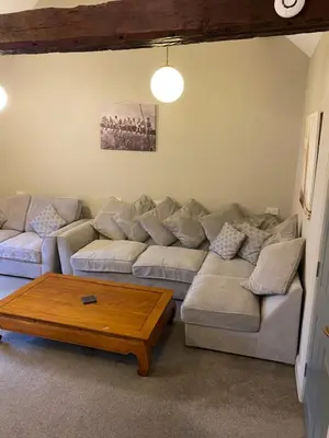 a living room with a couch and a coffee table at Kezbah 1, 22 the square centre of Dalston village in Dalston