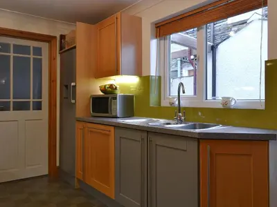 a kitchen with a sink and a microwave at Apple Cross in Keswick