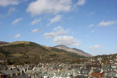 a town with houses and mountains in the background at Ferndene Guest House in Keswick