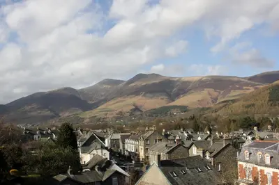 a town with houses and mountains in the background at Ferndene Guest House in Keswick