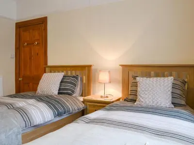 two beds sitting next to each other in a bedroom at The Beeches in Bassenthwaite