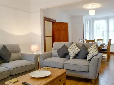 a living room with two couches and a table at The Beeches in Bassenthwaite