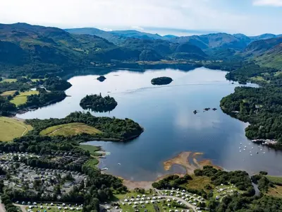 an aerial view of a lake in the mountains at 6 Elm Court in Keswick