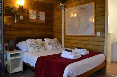 a bedroom with two beds with towels on them at Robin's Lodge in Westward