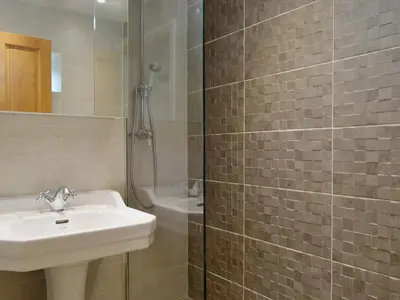 a bathroom with a sink and a shower at High Birch Close in Patterdale