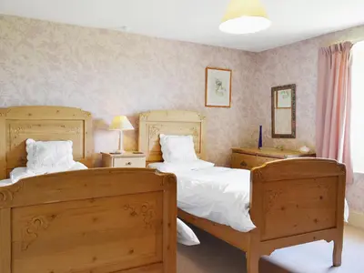 a bedroom with two beds and two night stands at High Birch Close in Patterdale