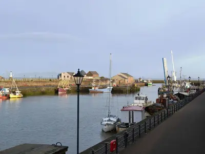 a group of boats are docked in a marina at Ritson Wharf in Maryport