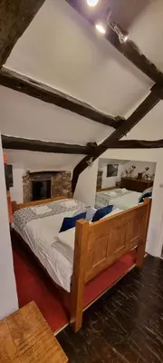 a bedroom with a wooden bed in a room at The Big 
