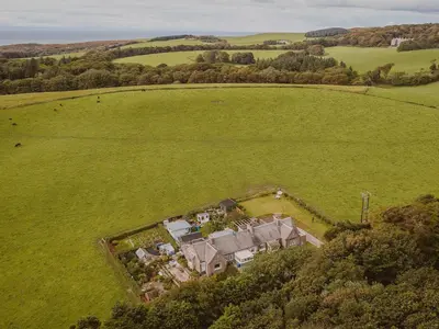 an aerial view of a house in a field at Wild Geese Lodge - Uk31046 in Portpatrick