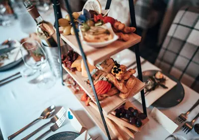 a three tiered plate of food on a table at Buttermere Court Hotel in Buttermere
