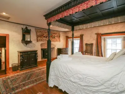 a bedroom with a large bed in a room at The Pend in Newton Stewart