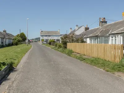 an empty street in a village with houses at Sandpiper in Dumfries